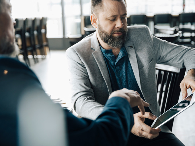 Businessmen Using Digital Tablet